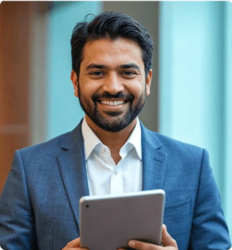 Manager in a blazer holding a tablet in a modern office
