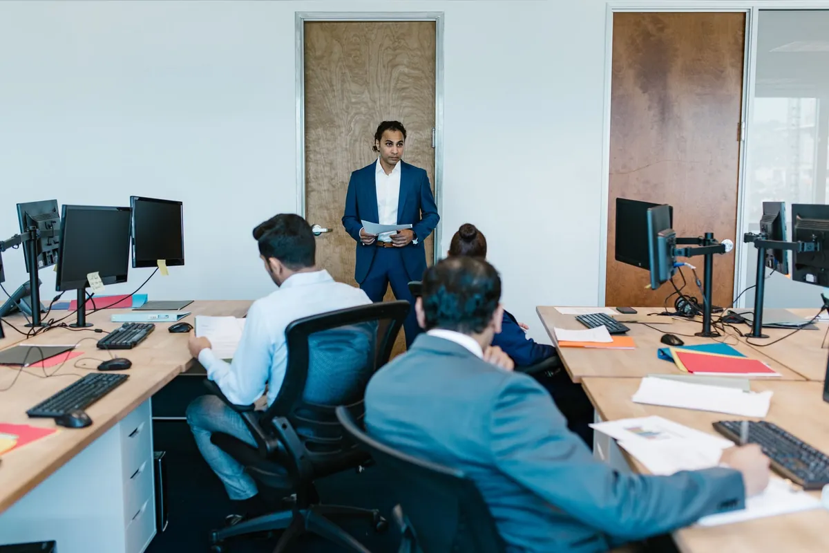 Business leader presenting to a team in a conference room