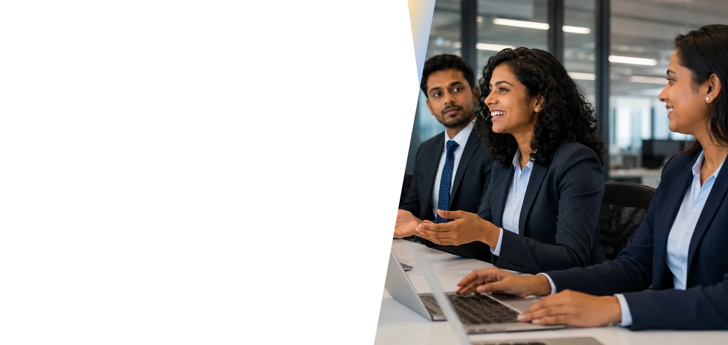 Banking professionals collaborating in a meeting with laptops in a modern office