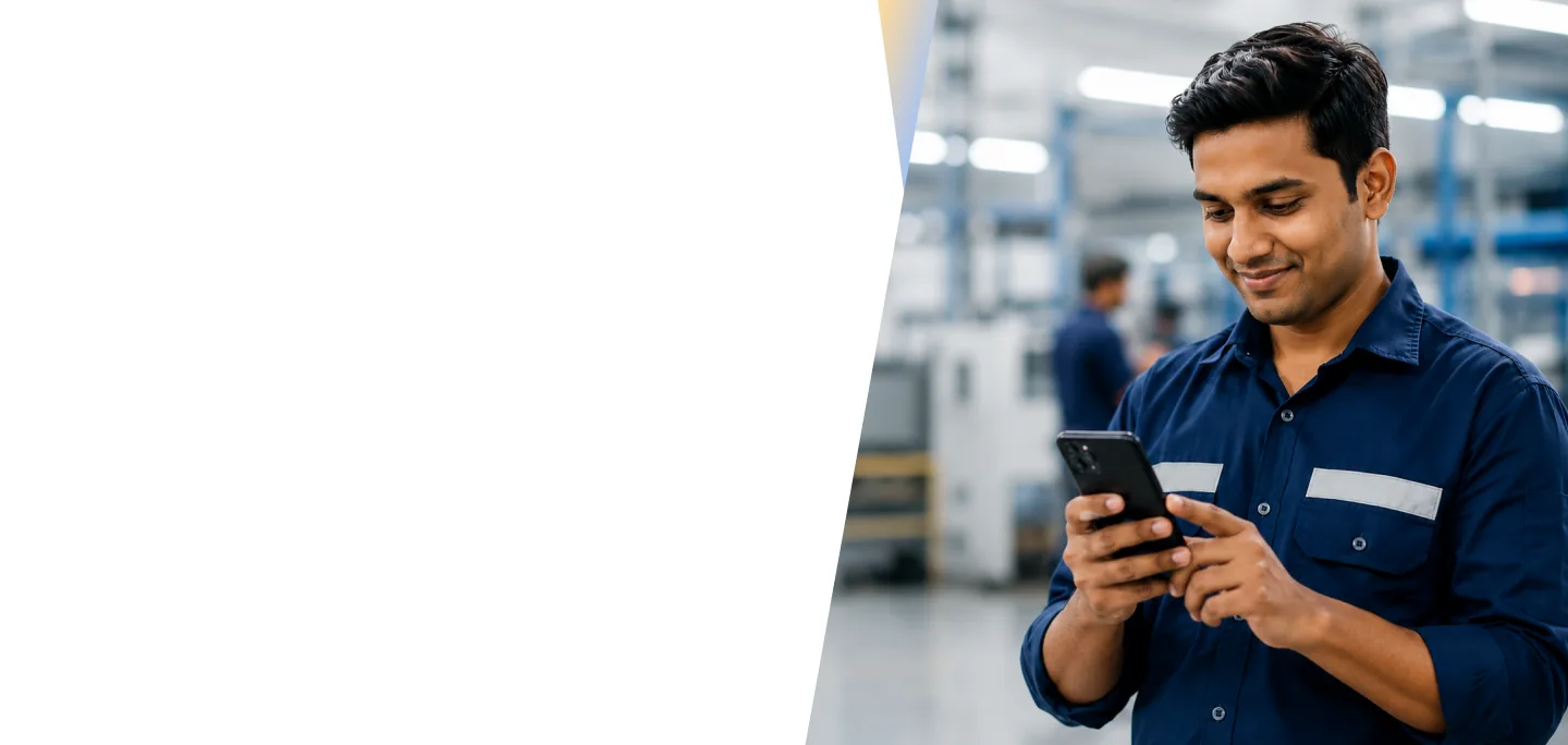 Industrial worker using a smartphone to access HR services in a manufacturing facility
