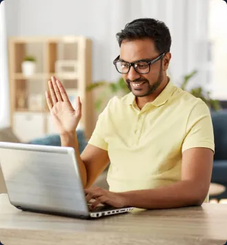 Remote team member on a video call while working from a home office