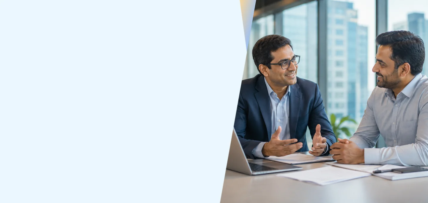 Two business professionals discussing workforce management in a modern office with city views
